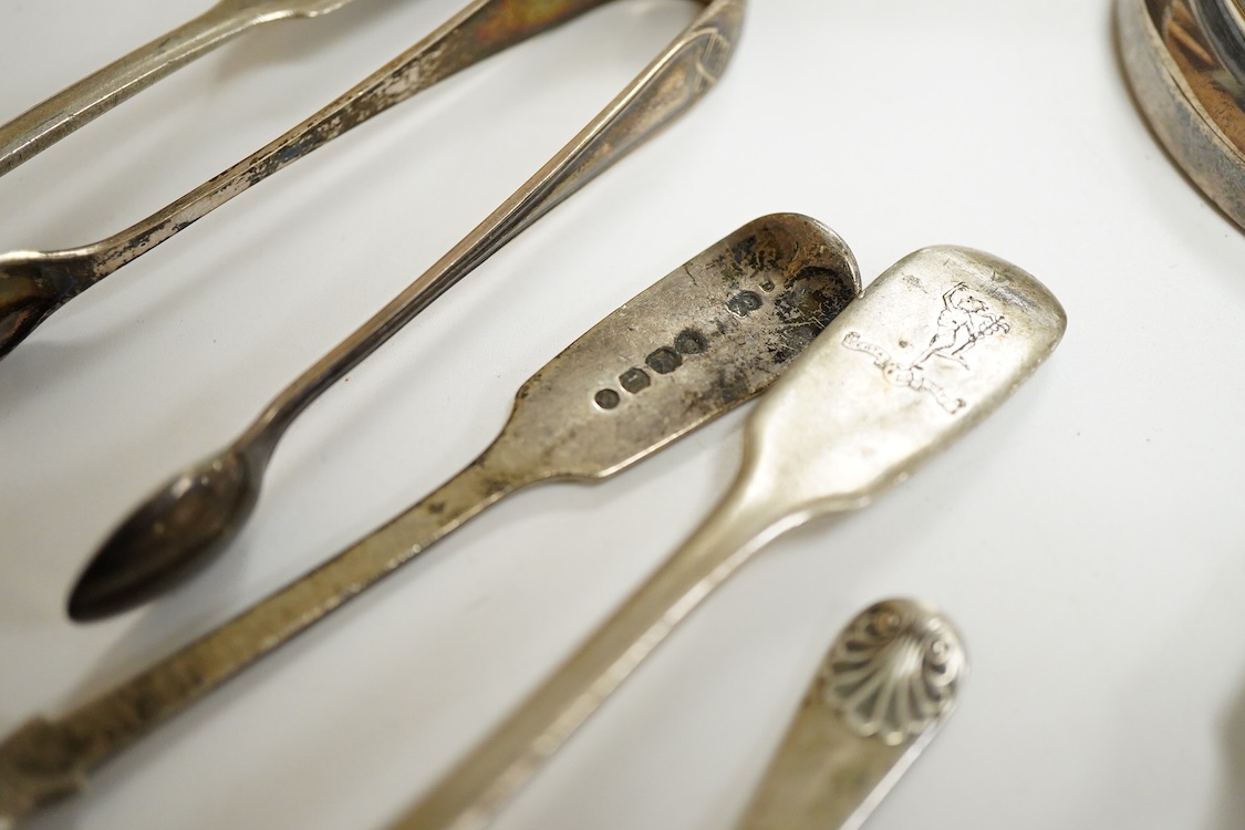 A small group of silver including a modern two branch, three light dwarf candelabrum by Sanders & Mackenzie, height 10.2cm, weighted, a pair of handled glove stretchers and eight small items of flatware.